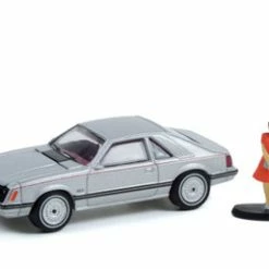 Greenlight 1979 Ford Mustang Coupe Ghia And Woman In A Dress Figurine, 97120B/48 1/64 Scale Diecast Car